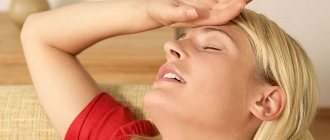 Woman lying with hand on head